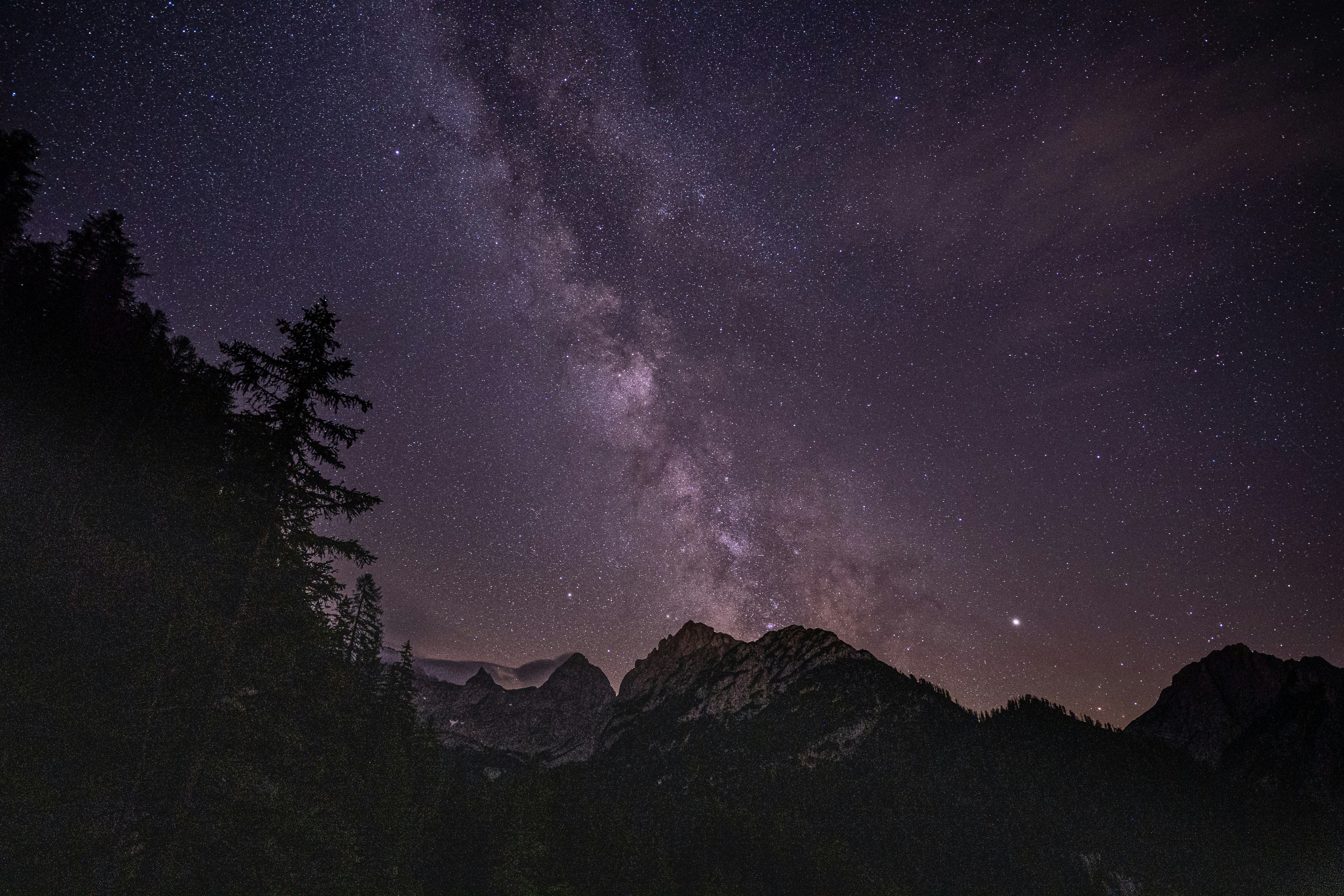 Night sky with stars over mountains